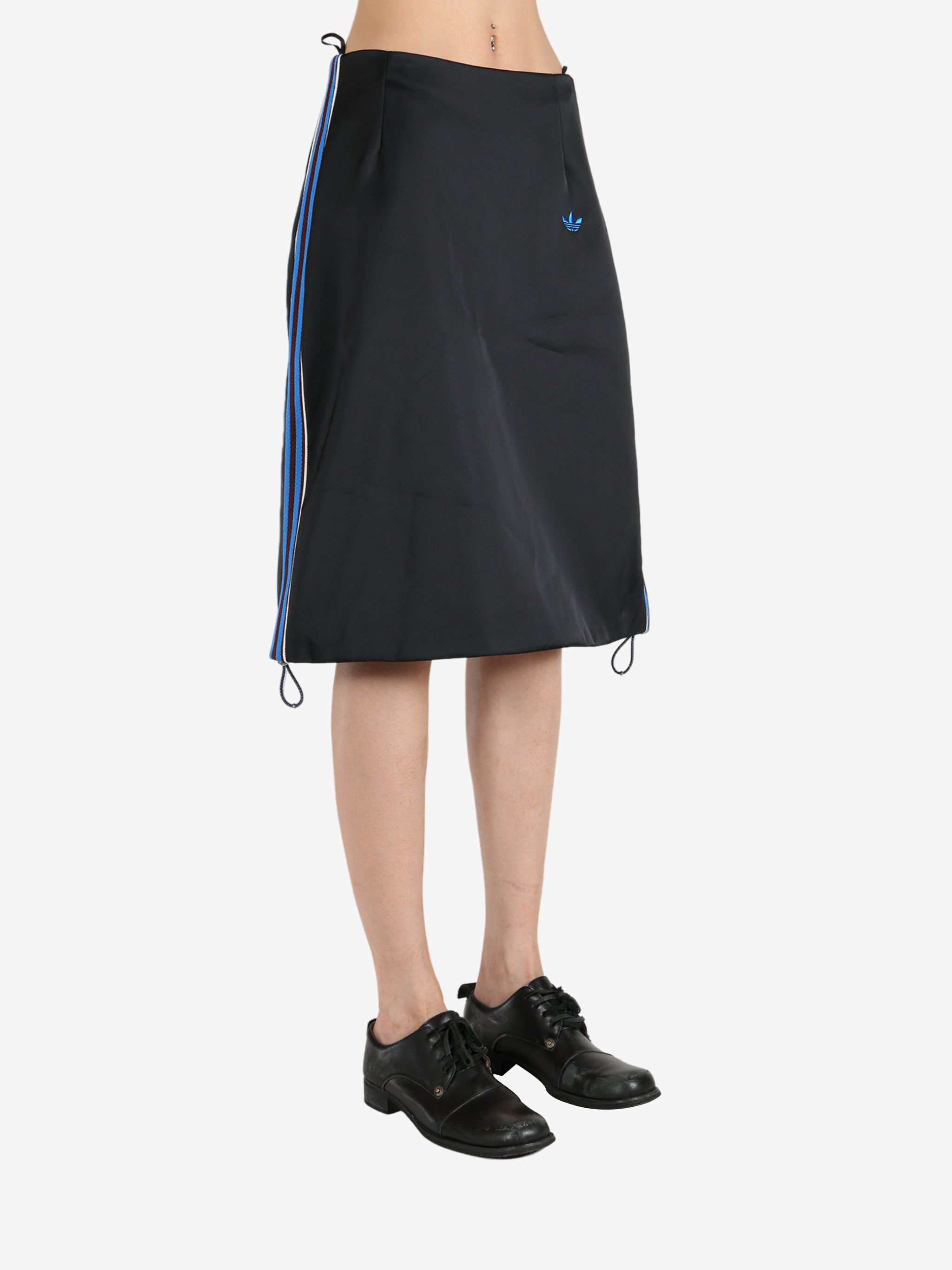 Black skirt worn by a person, showing the skirt 's fit