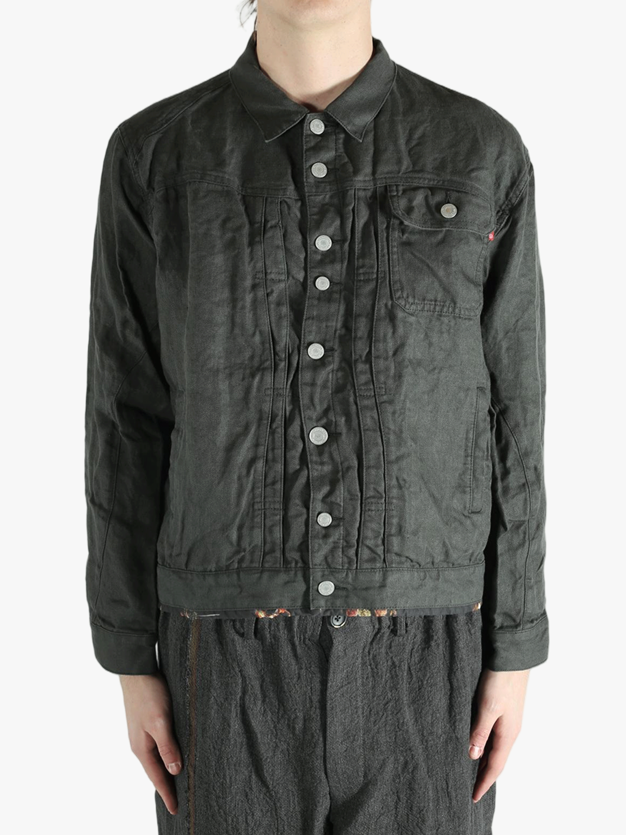 Black jacket worn by a person, showing the jacket's fit