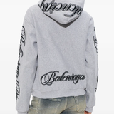 Grey sweats-hoodies worn by a person, showing the cotton fit