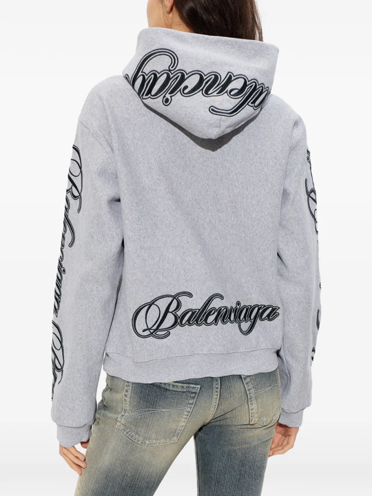 Grey sweats-hoodies worn by a person, showing the cotton fit