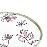 Close up of white plate, showing texture of the bone china fabric