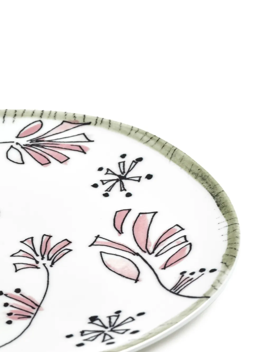 Close up of white plate, showing texture of the bone china fabric