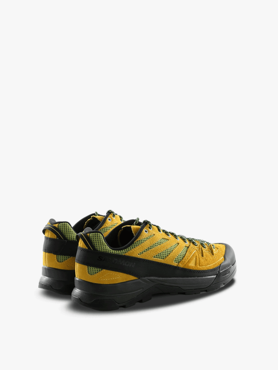 Yellow and black athletic shoe,back view