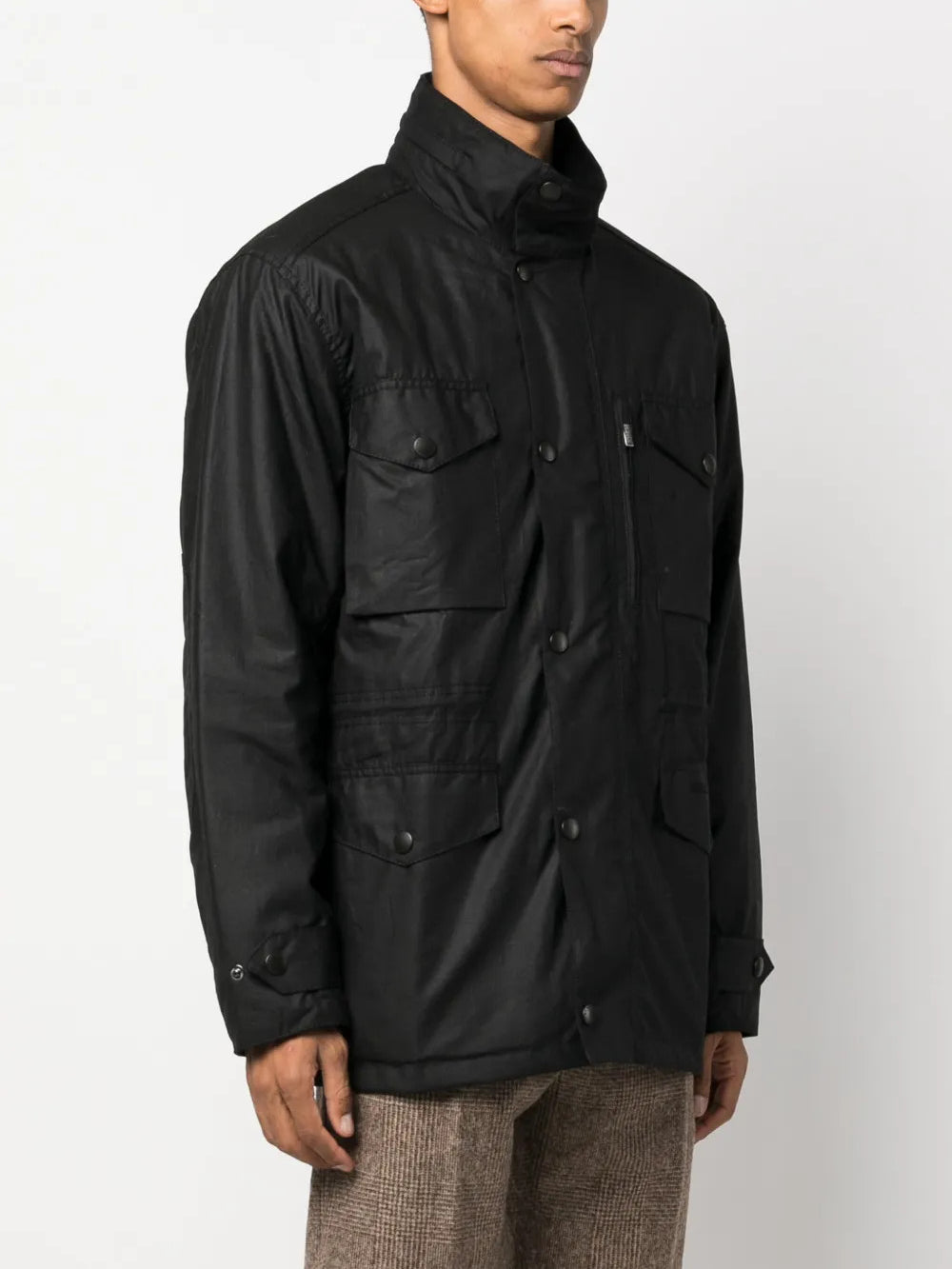 Black jacket worn by a person, showing the jacket fit