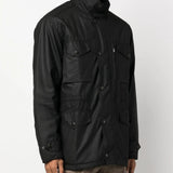 Black jacket worn by a person, showing the jacket fit
