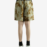 Green pants worn by a person, showing the pants' fit