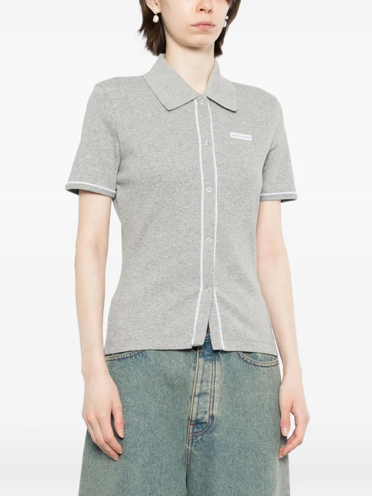 Grey t-shirt worn by a person, showing the t-shirt fit