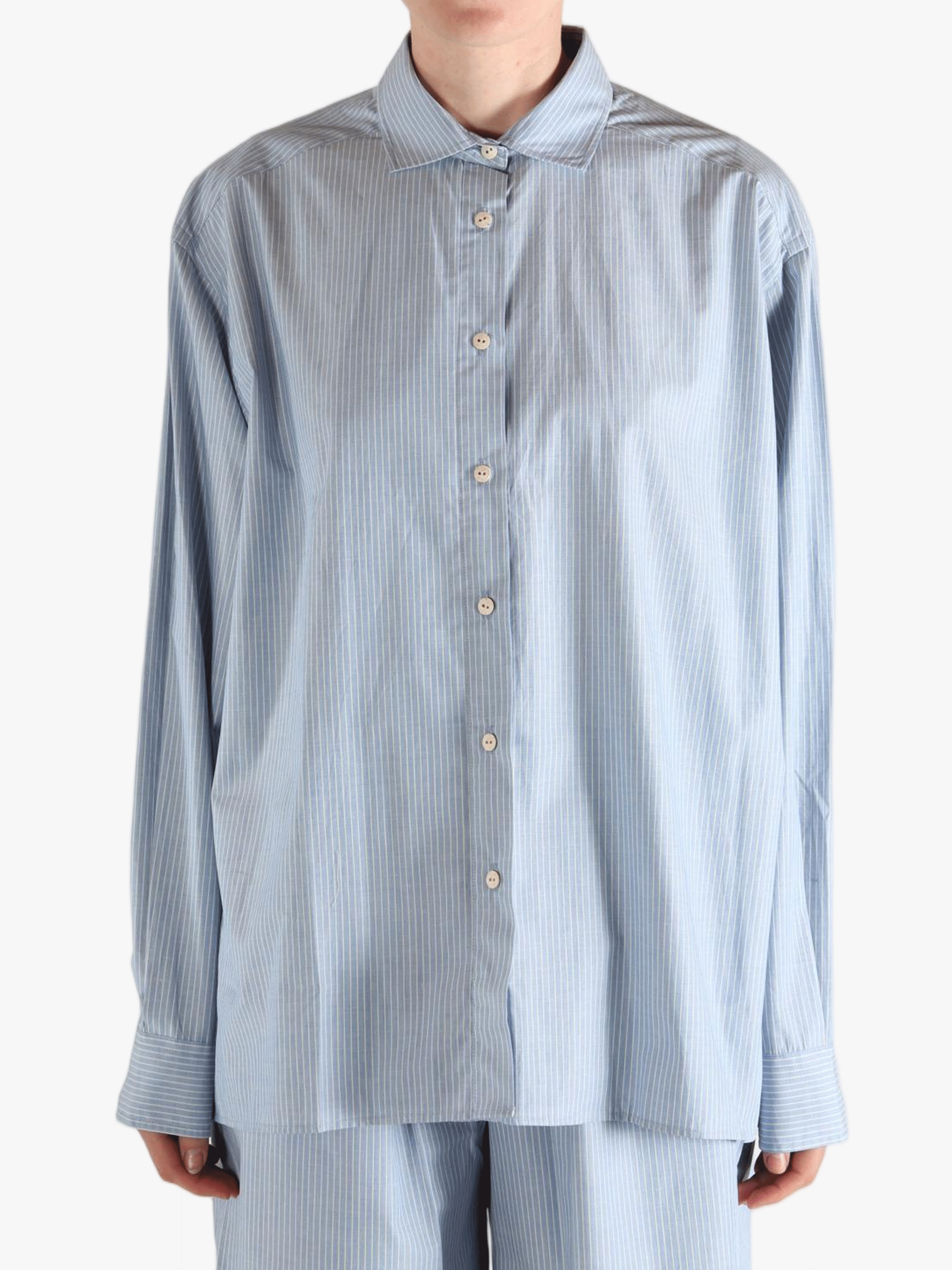 Blue shirt worn by a person, showing the shirt's fit
