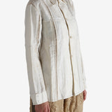 White shirt worn by a person, showing the shirt's fit