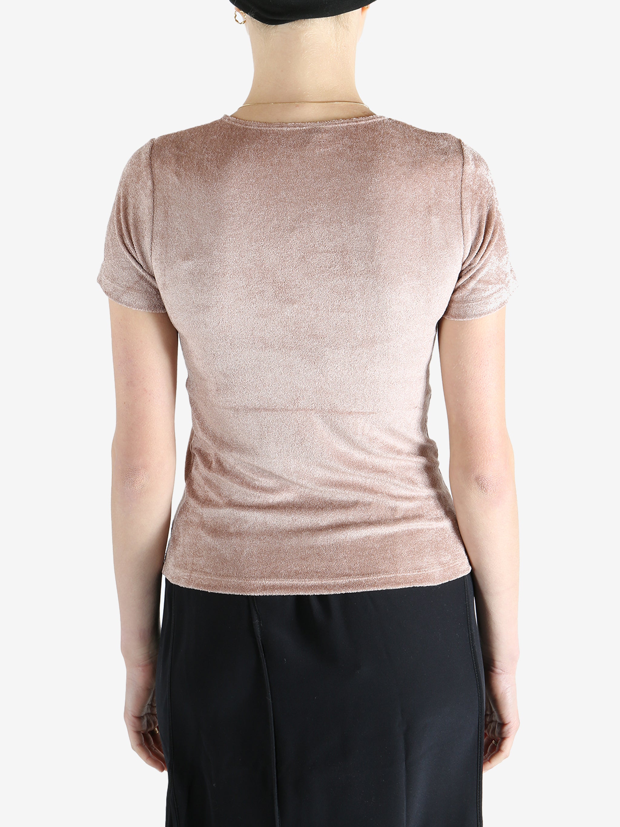 Pink t-shirt worn by a person, showing the shirt's fit