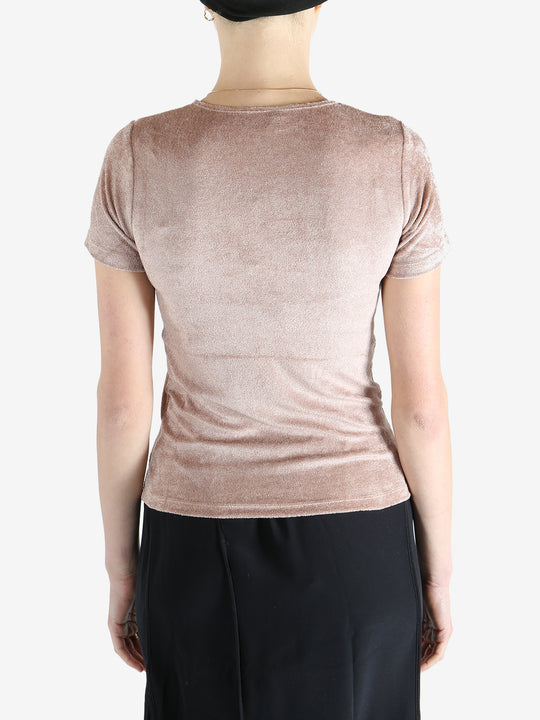 Pink t-shirt worn by a person, showing the shirt's fit