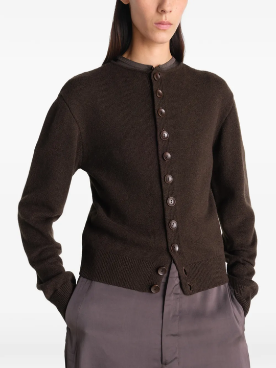 Brown knitwear worn by a person, showing the knitwear's fit
