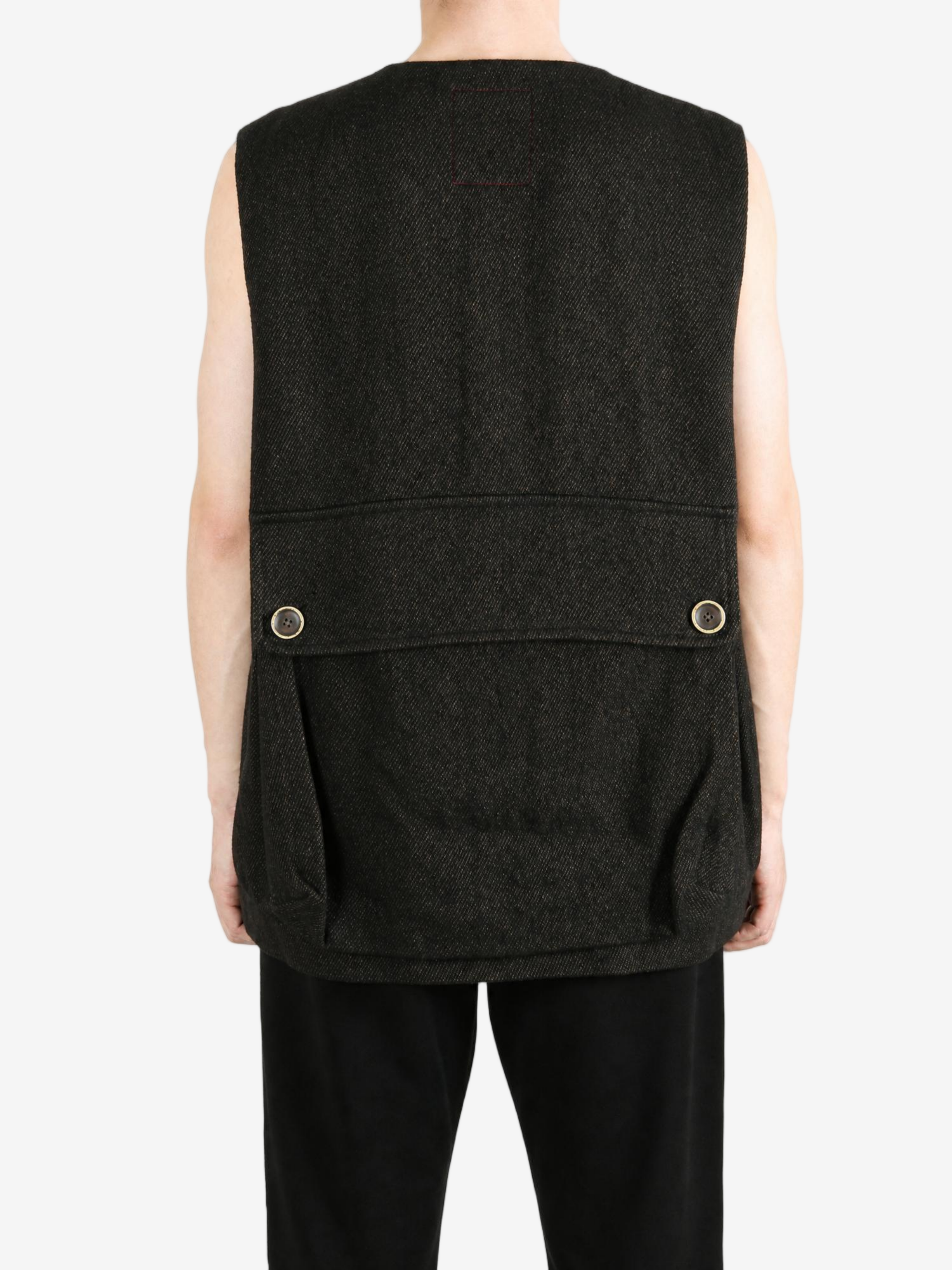 Black jacket worn by a person, showing the jacket fit