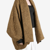 Brown jacket worn by a person, showing the jacket fit