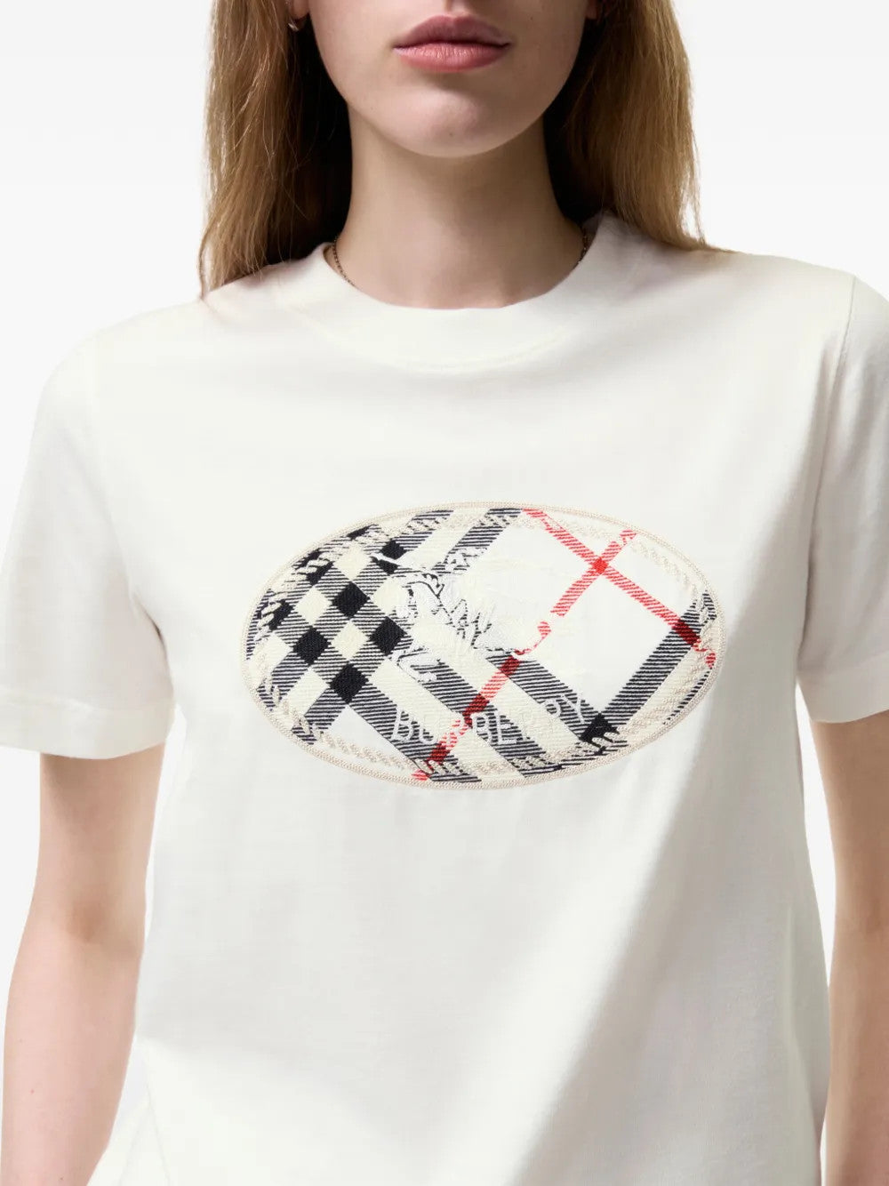 Tan t-shirt worn by a person, showing the t-shirt fit