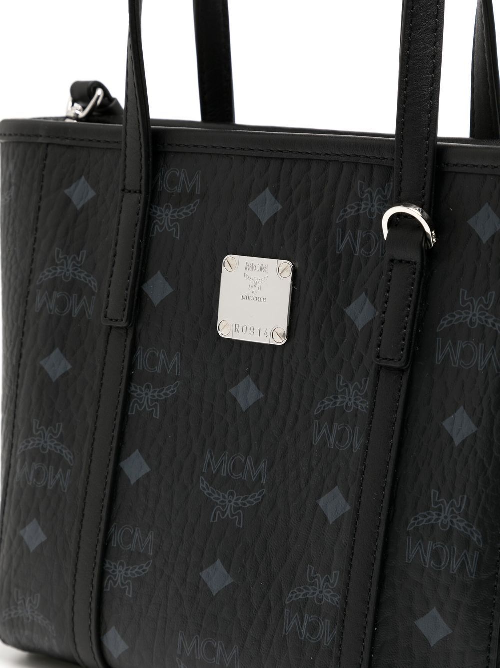 Close up of black bag, showing texture of the leather fabric