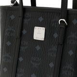 Close up of black bag, showing texture of the leather fabric