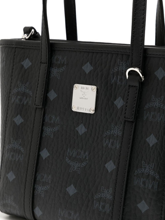 Close up of black bag, showing texture of the leather fabric