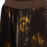 Close up of brown pants, showing texture of the viscose fabric