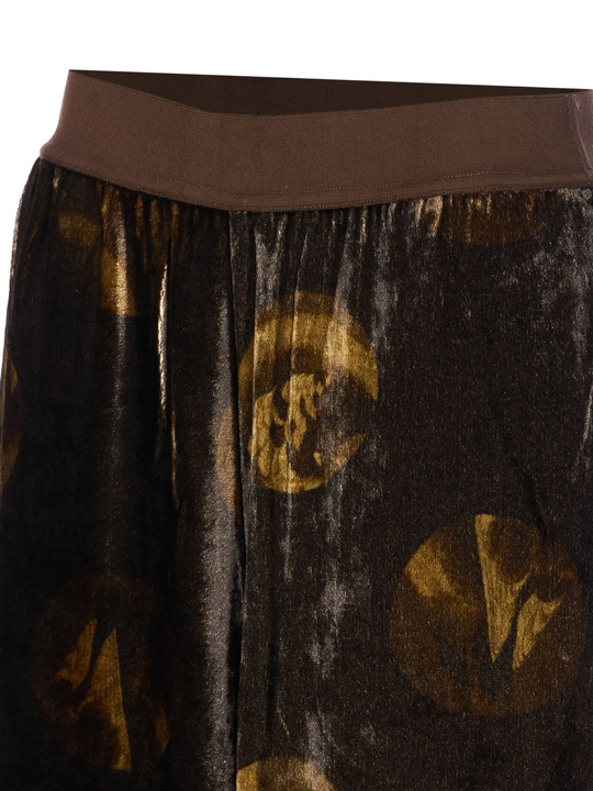 Close up of brown pants, showing texture of the viscose fabric