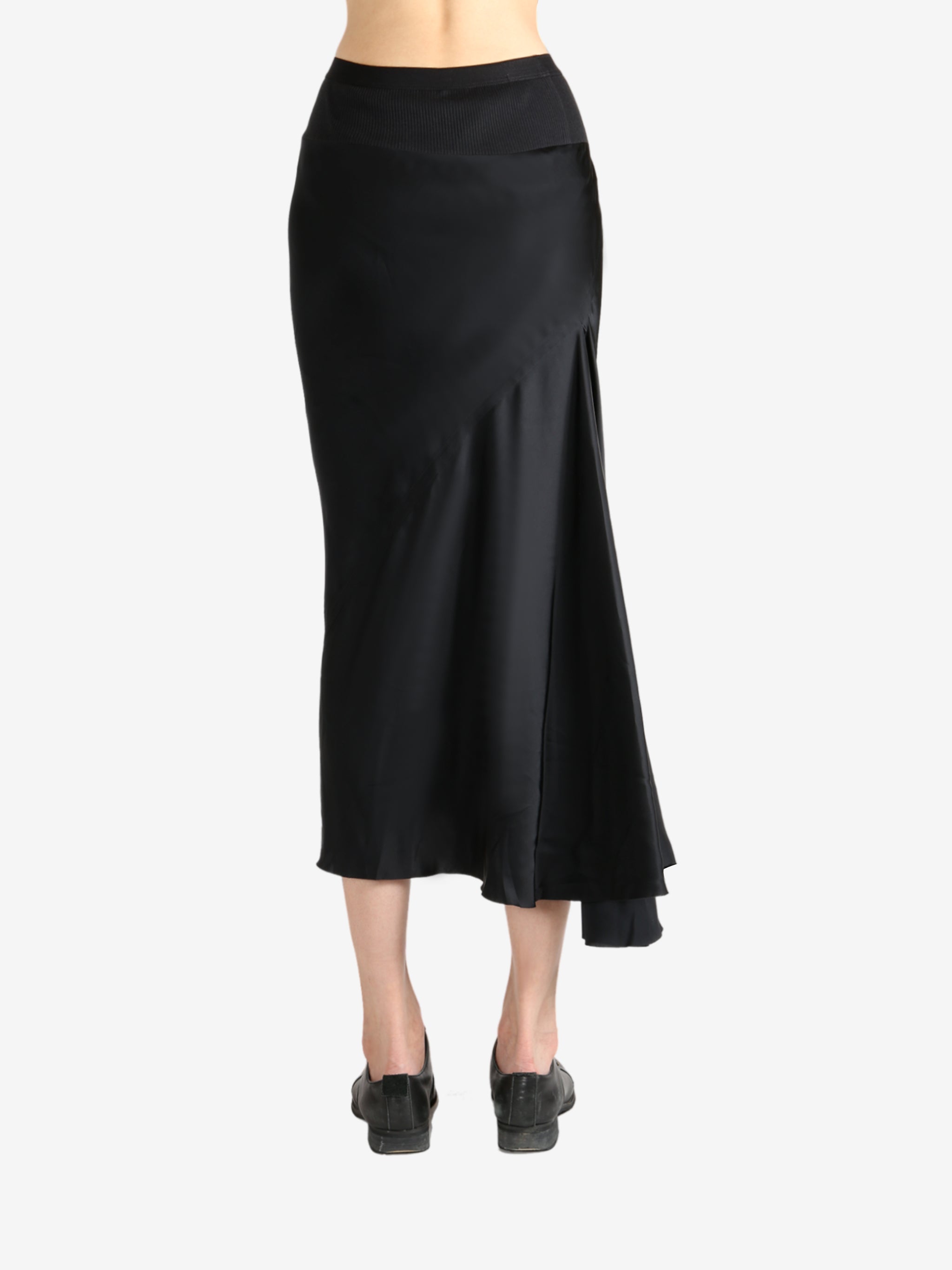 Black skirt worn by a person, showing the skirt's fit
