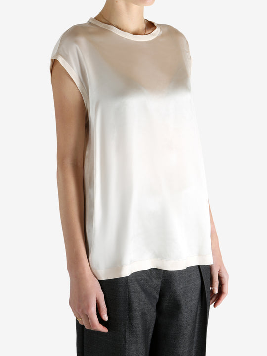 Grey t-shirts worn by a person, showing the t-shirts fit