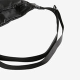 Close up of black bags, showing texture of the nylon fabric