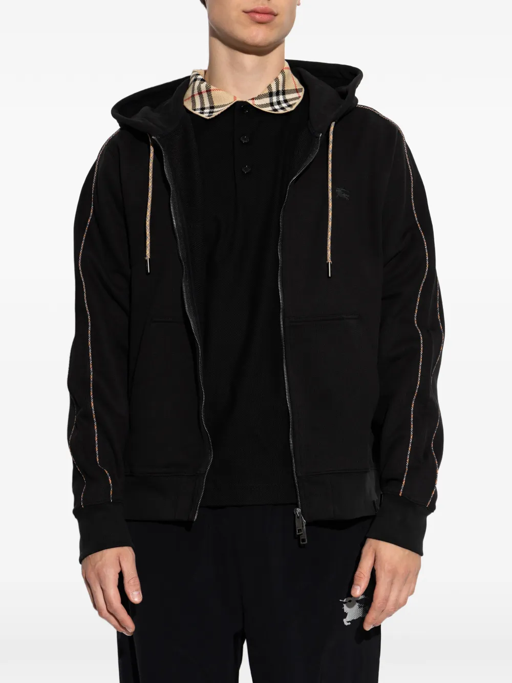 Black hoodies worn by a person, showing the black hoodies' fit