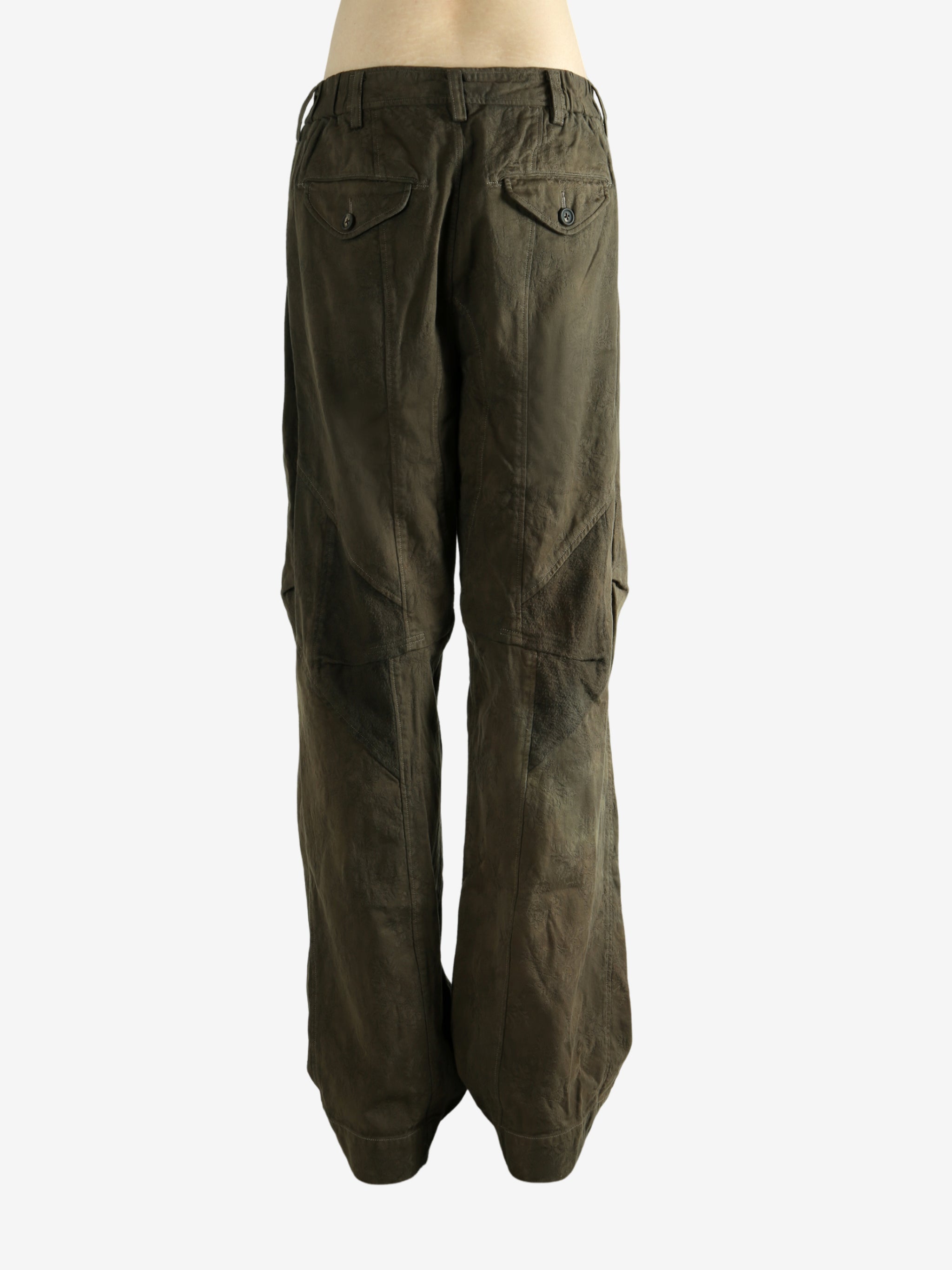 Green pants worn by a person, showing the pants fit