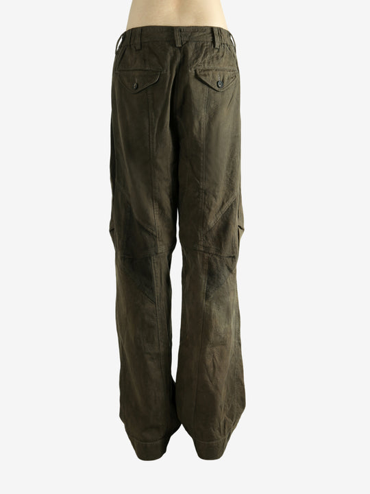 Green pants worn by a person, showing the pants fit