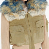 Tan jacket worn by a person, showing the jacket fit