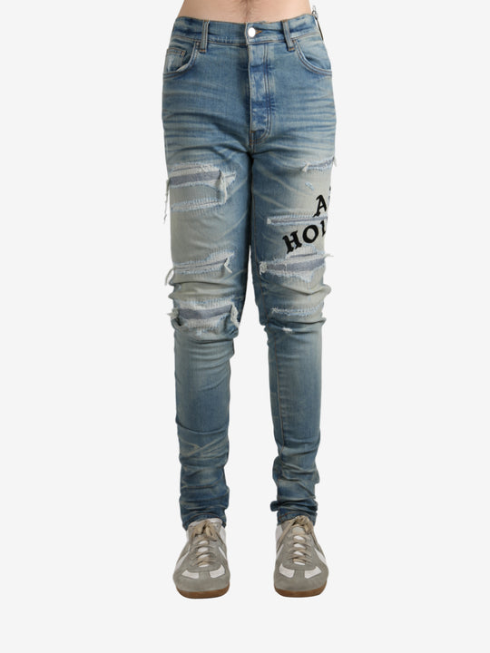 Blue pants worn by a person, showing the pants fit