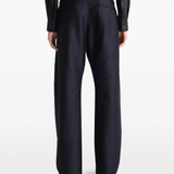 Black pant worn by a person, showing the pant's fit