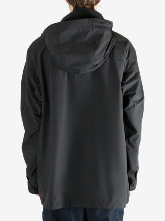 Black jacket worn by a person, showing the jacket's fit