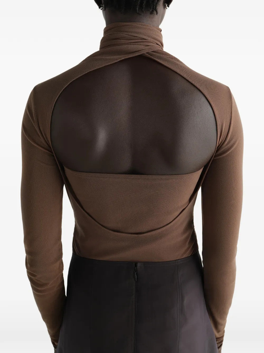 Brown top worn by a person, showing the top fit