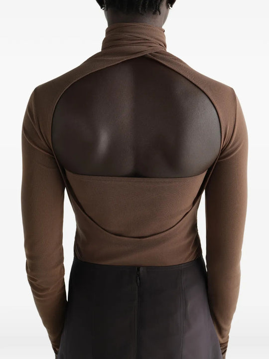 Brown top worn by a person, showing the top fit