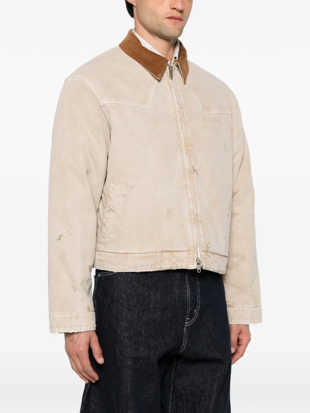 Tan jacket worn by a person, showing the jacket fit