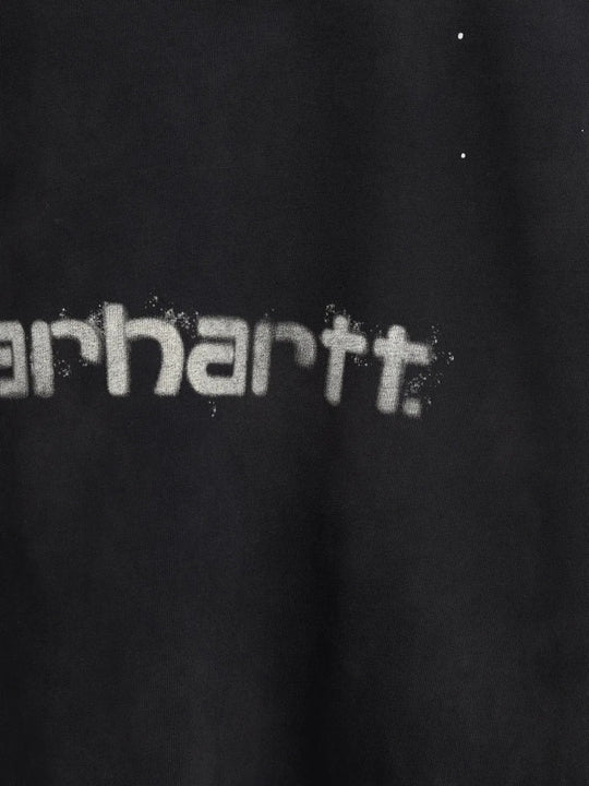 Close up of Black t-shirt, showing texture of the 100% organic cotton made fabric