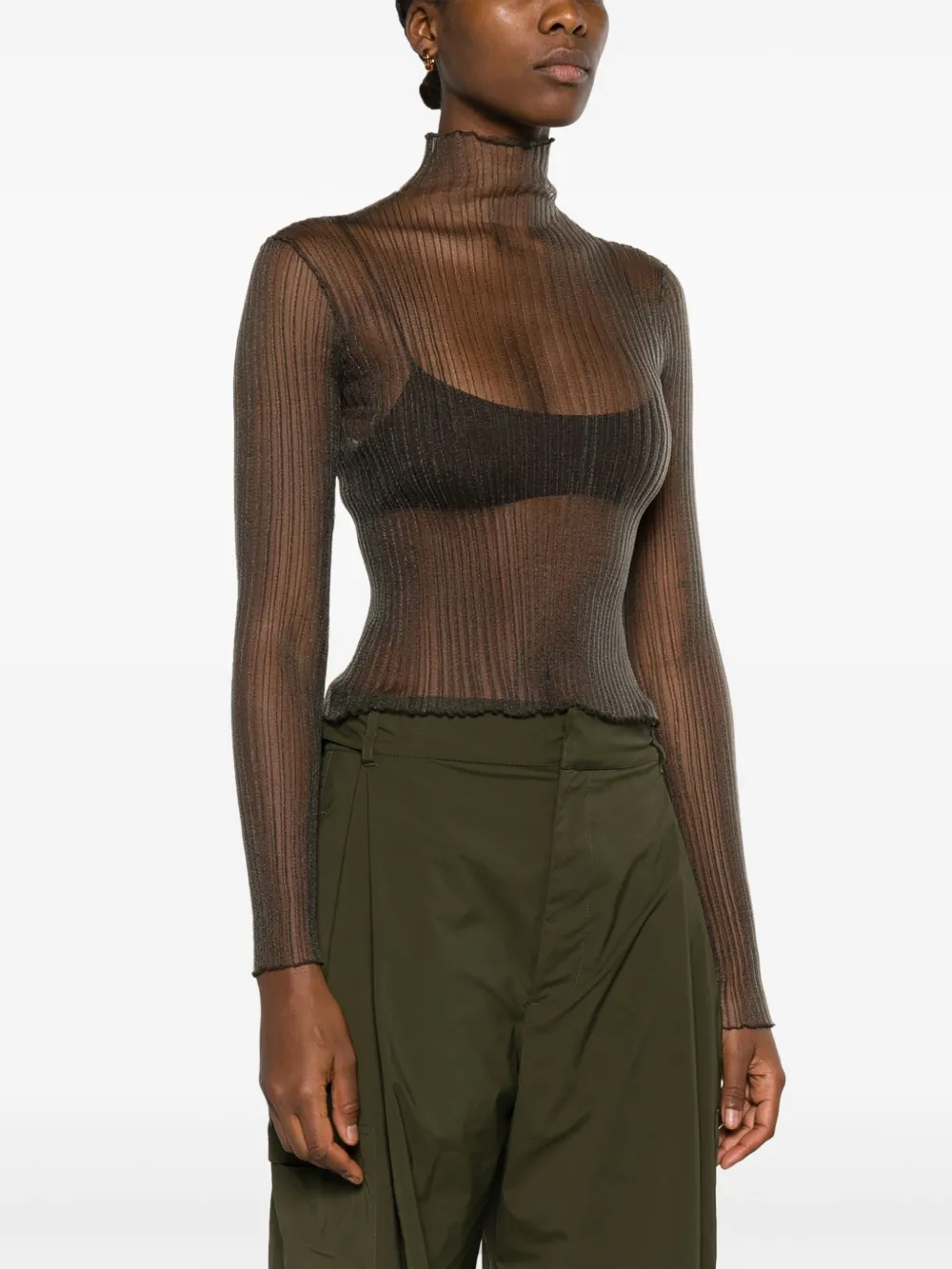 White top worn by a person, showing the tops fit