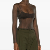 White top worn by a person, showing the tops fit