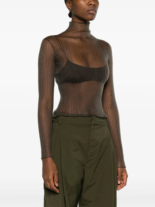 White top worn by a person, showing the tops fit