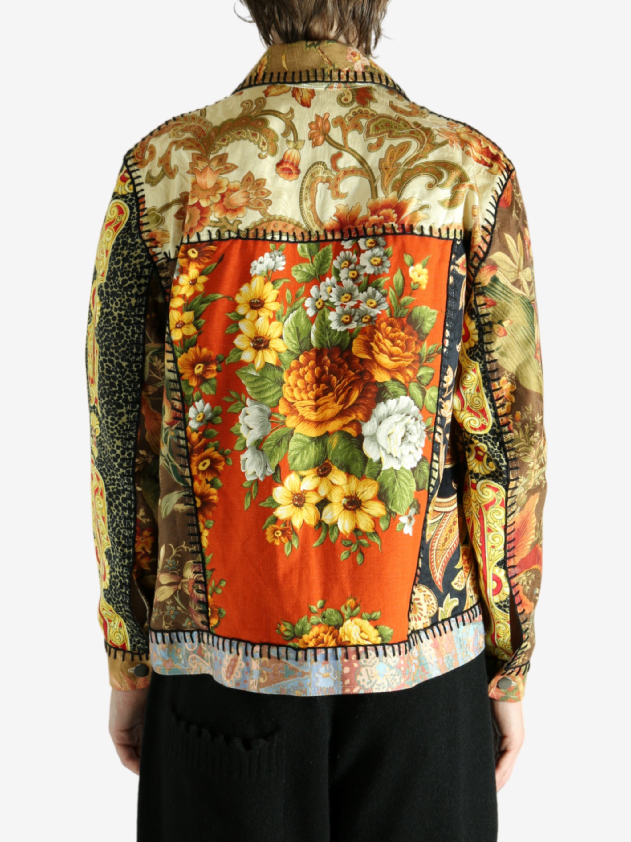 Brown jacket worn by a person, showing the jacket’s fit