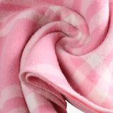 Close up of pink scarf, showing texture of the Cashmere fabric