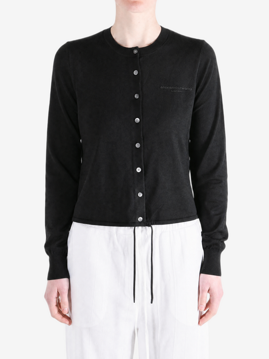 Black jacket worn by a person, showing the jacket fit