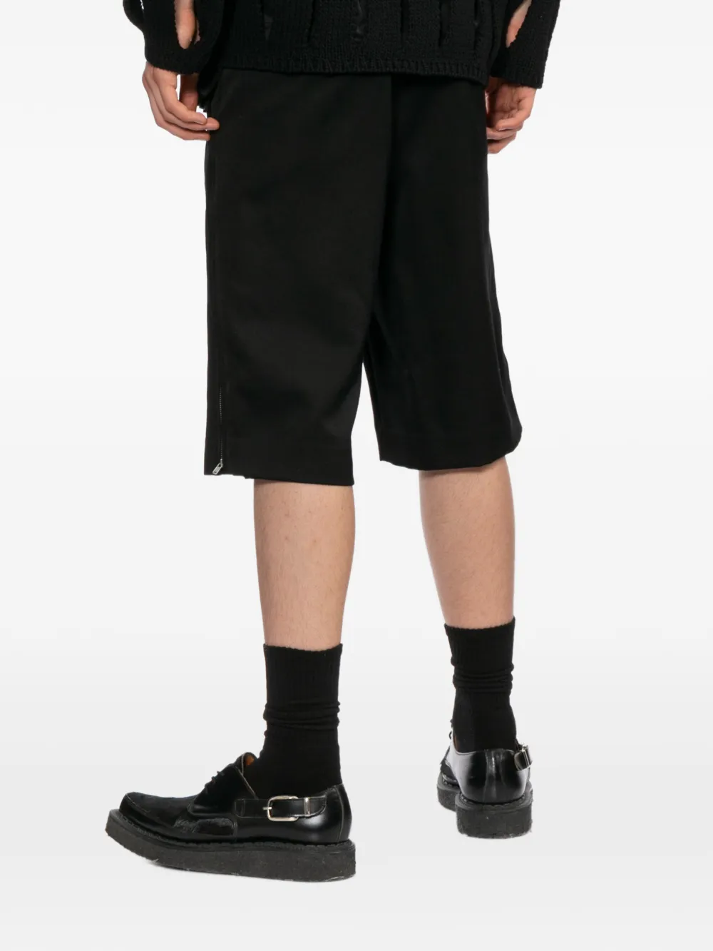 Black shorts worn by a person, showing the shorts's fit