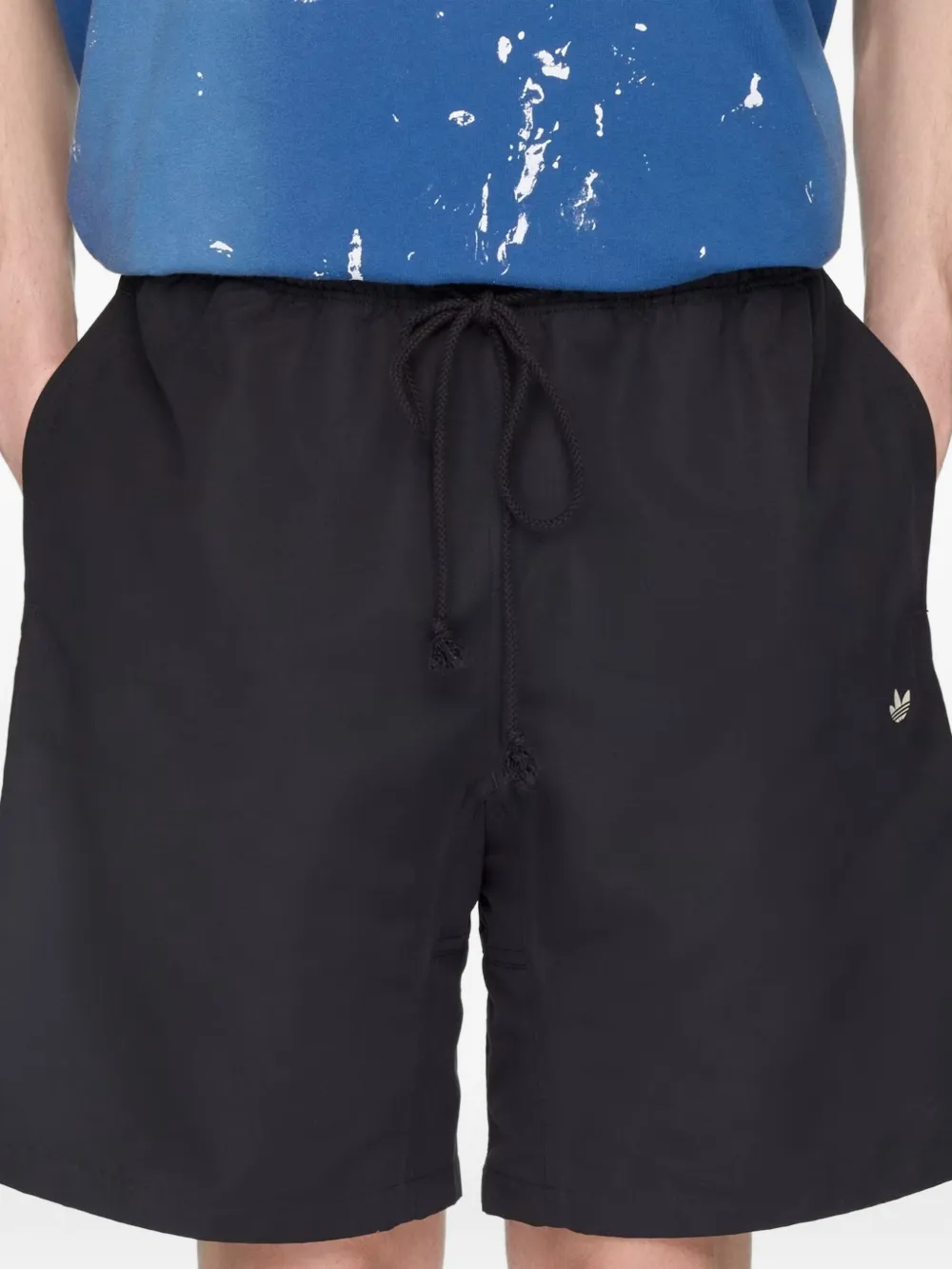 Black shorts, worn by a person, showing the shorts' fit