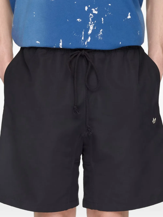 Black shorts, worn by a person, showing the shorts' fit