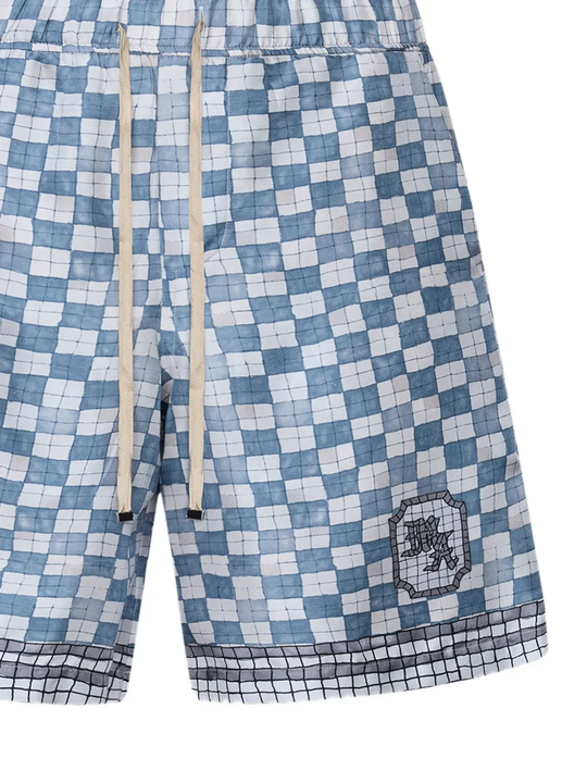 close up of blue shorts, showing texture of the silk fabric