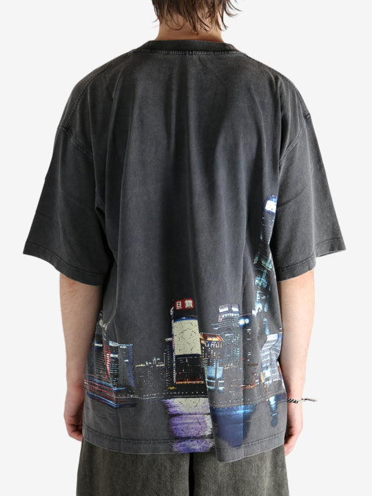 Black shirt worn by a person, showing the shirt fit