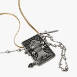 Necklace with a pendant featuring a character and text on a white background